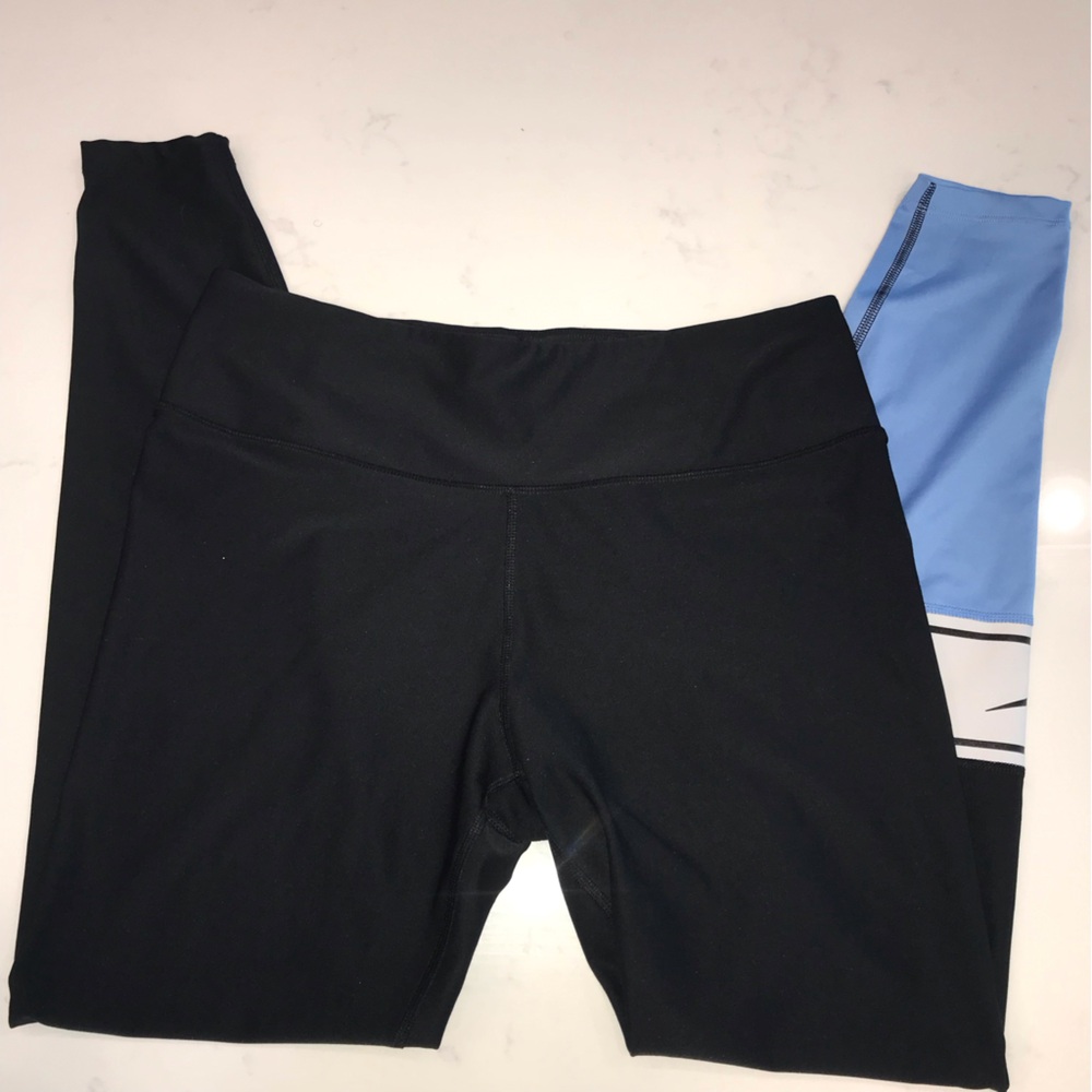 Nike dry fit leggings with Columbia blue on one leg size large